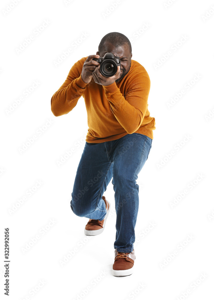 Fototapeta premium African-American photographer on white background