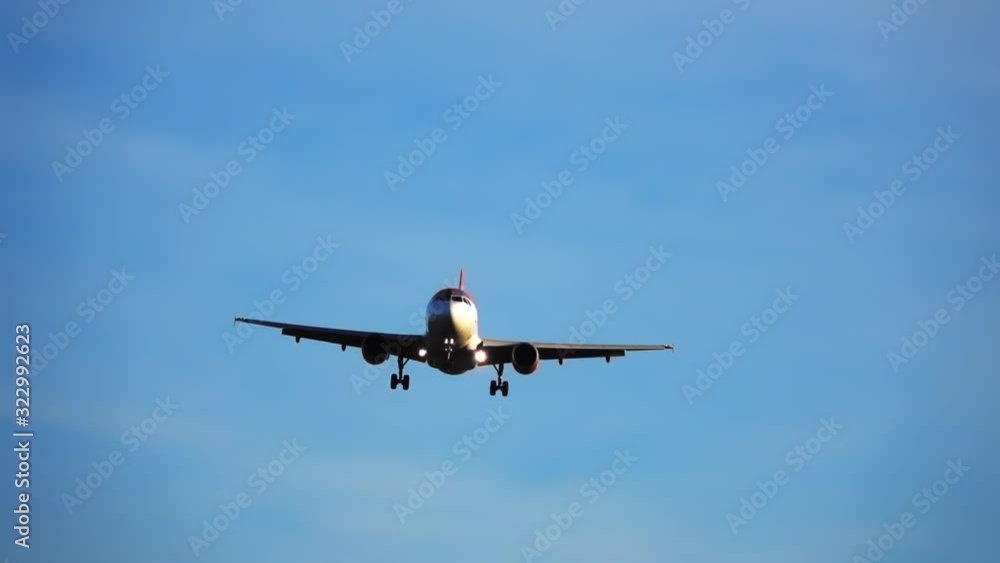 A small plane with headlights on arrives at the airport A small plane with headlights on arrives at the airport
