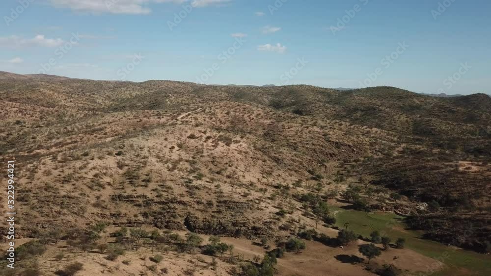 4K aerial drone summer day video African savanna and dry riverbeds surrounded by bush covered hills in Daan Viljoen National Game Park in Khomas Hochland area near Windhoek, Namibia's capital, Africa 4K aerial drone summer day video African savanna and dry riverbeds surrounded by bush covered hills in Daan Viljoen National Game Park in Khomas Hochland area near Windhoek, Namibia's capital, Africa