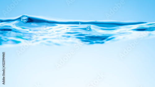 Clear water waves. Water blue wave splash isolated on white background. Clear water waves. Water wave and air bubbles isolated over white background.