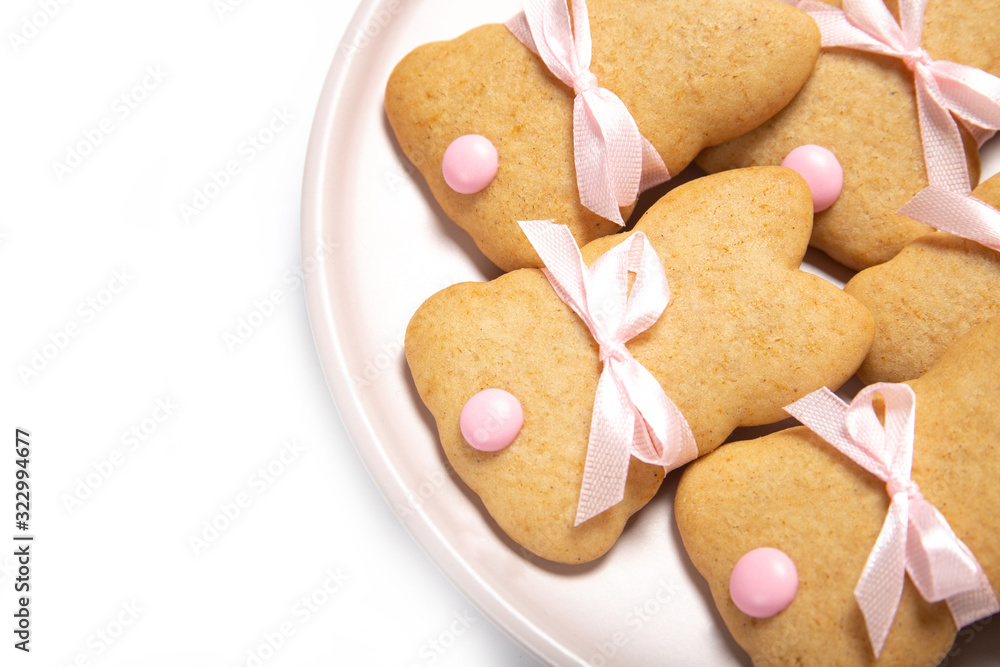 Easter cookies on a plate on a white background, place for text, easter bunny, top view, isolation, Easter cookies on a plate on a white background, place for text, easter bunny, top view, isolation,