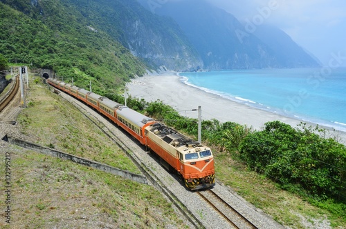 An electric passenger train near the pacific ocean