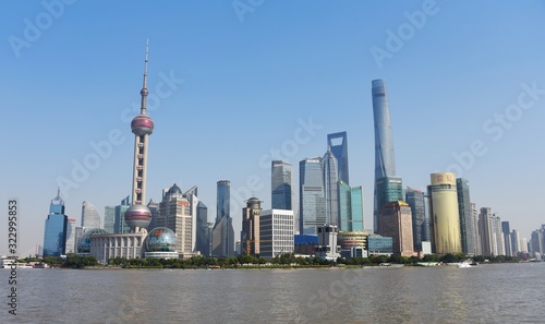 Lujiazui is located on the Bank of Huangpu River in Pudong New Area of Shanghai  facing the Bund across the river. It is the headquarters of many multinational banks in Greater China and East Asia  an