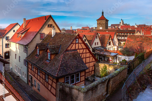 Aerial view from town wall of Weisser Turm and quaint colorful facades and roofs of medieval old town of Rothenburg ob der Tauber, Bavaria, Germany