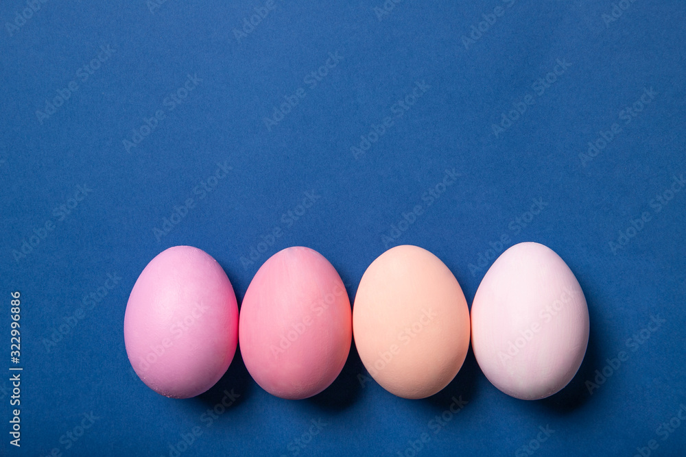 Easter eggs on a blue background, Place for text, Top view, Postcard. Easter eggs on a blue background, Place for text, Top view, Postcard.