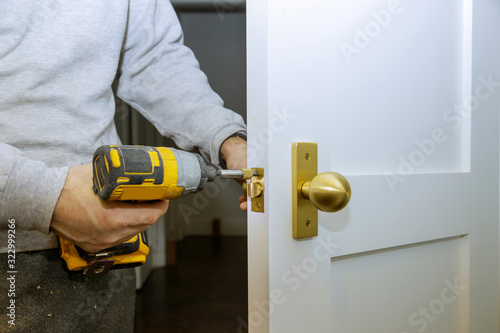 Builder is installing lock a doot in the room photo