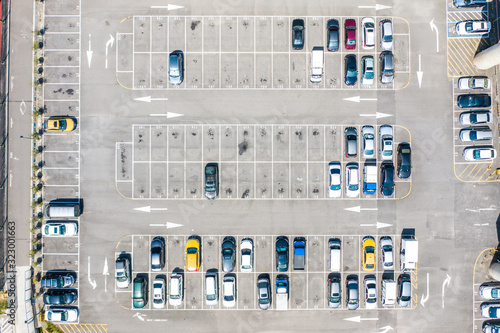 Empty parking lots, aerial view. A lot of cars in the parking lot. Colorful moody drone shoot.