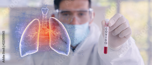 double exposure of coronavirus covid-19 infected blood sample in sample tube in hand of scientist with biohazard protection cloth and pneumonia lung photo