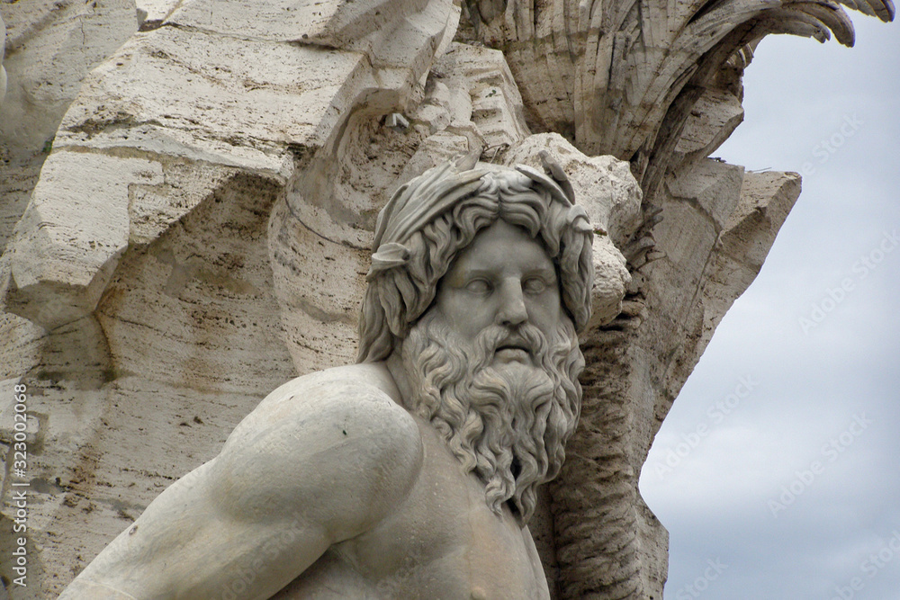 Close-up of the head of a sculpture of the Fountain of the Four Rivers (Fontana dei Quattro Fiumi) in Rome, Italy, Europe