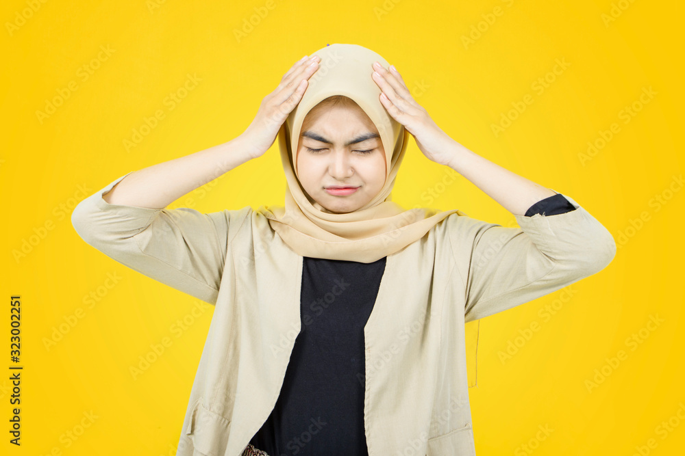 Portrait of Asian women with sad face on yellow background