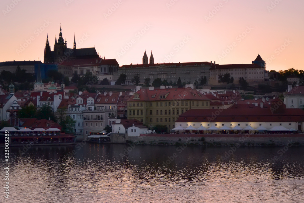 Evening landscape of the Vltava river and Prague Castle in Old Prague. Beautiful sunset.