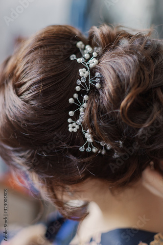 Very beautiful hairstyle with a diadem in the hair.