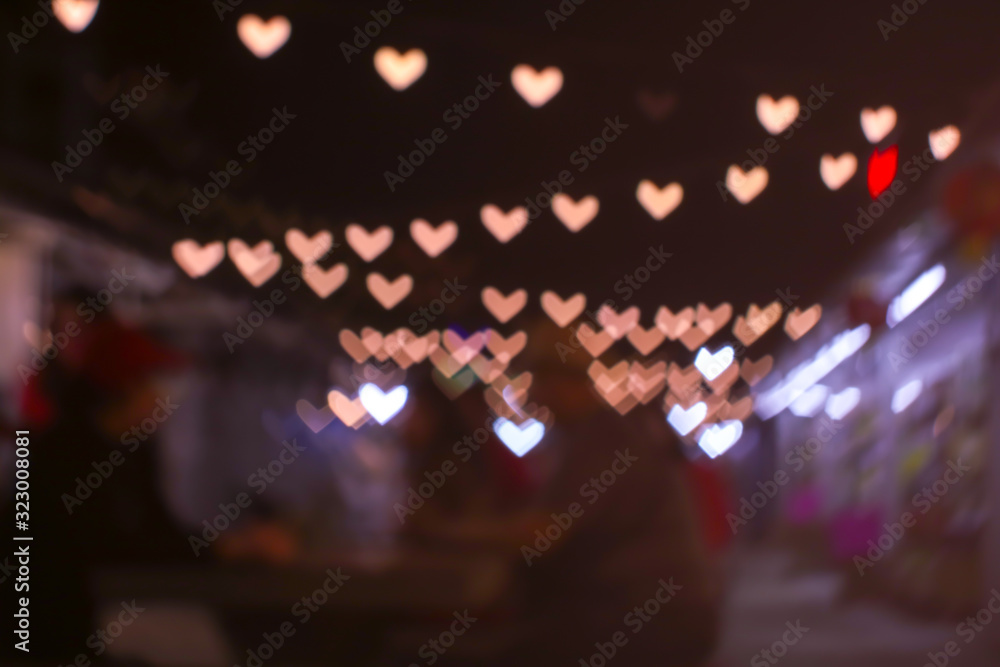gold bokeh and blur heart shape love valentine day colorful night light on market