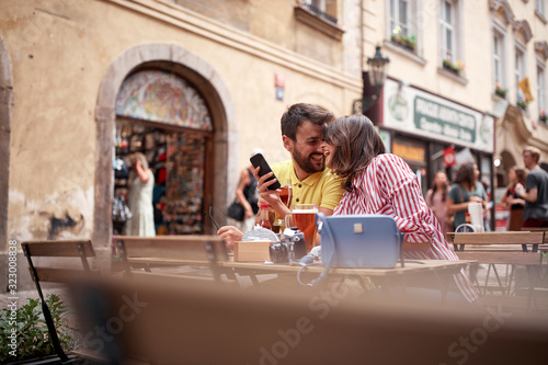 beautiful young couple having a good time on street cafe in prague. Vaneltine, Europe, Prague