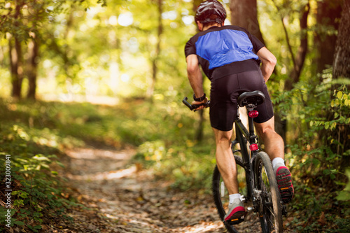 biking on a sunny day in the forest .Spring, nature ,sport concept