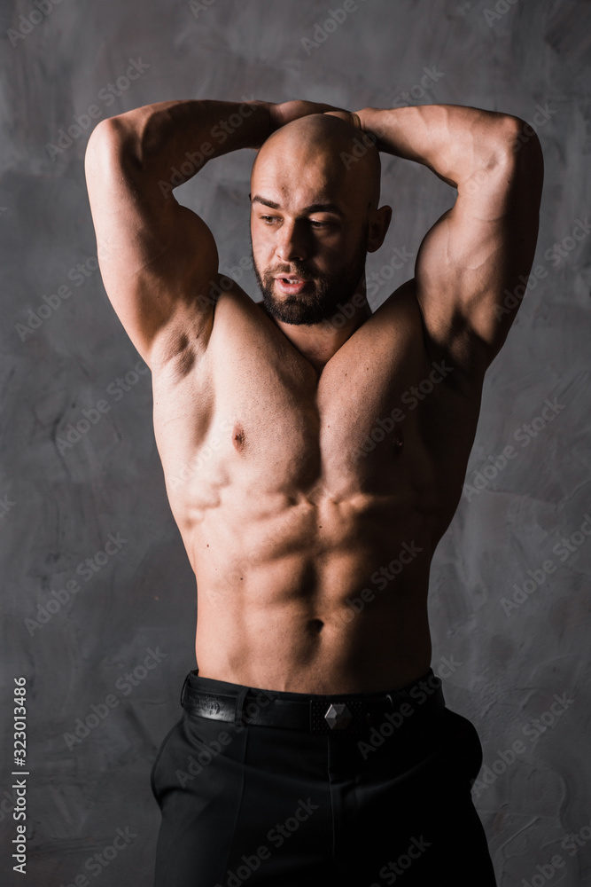 Fototapeta premium handsome muscular stylish bald man