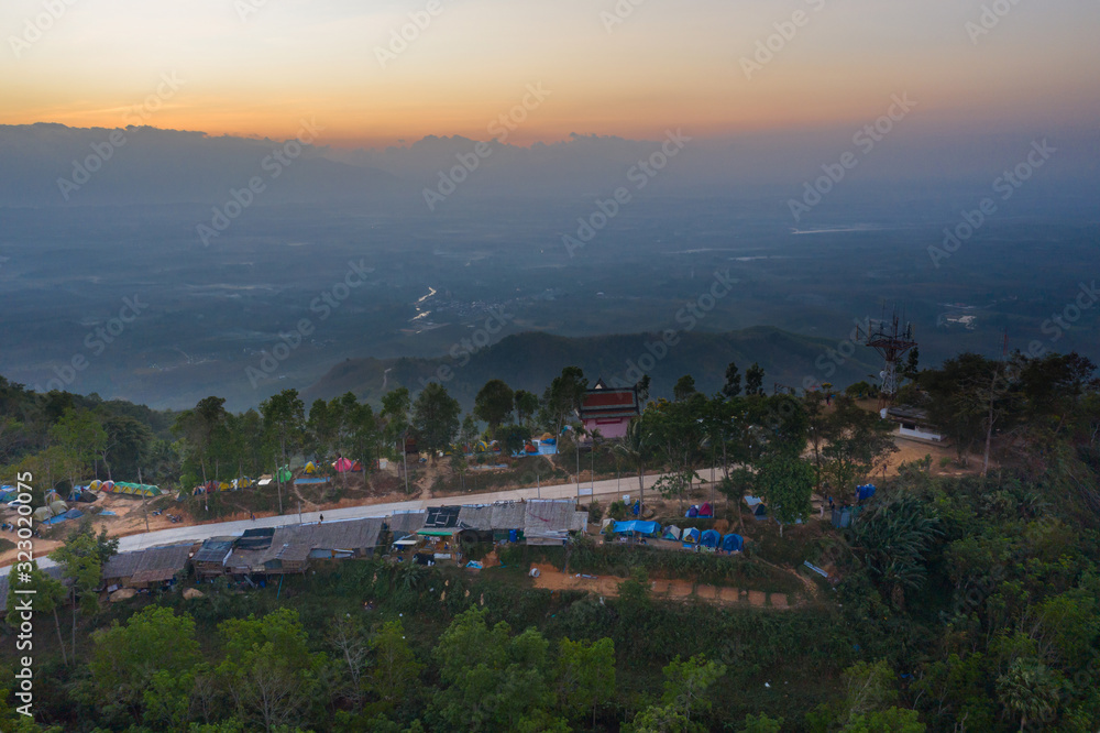 Fototapeta premium Khao Soon Sea Mist Sitting and watching the sea of mist Watch the sunrise Breathe fresh air at the viewpoint of the center hill. Nakhon Si Thammarat