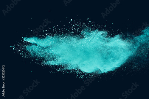 Fototapeta Naklejka Na Ścianę i Meble -  Blue sky color powder explosion on black background.