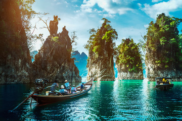 Group of adventure travelers on boat joy beautiful nature scenic landscape Khao Sok national park, Amazing landmark travel Thailand, Tourist people on holiday vacation trips, Tourism destination Asia