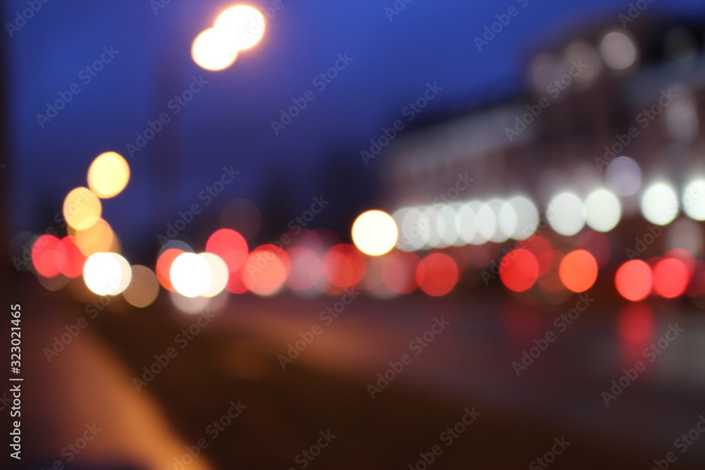 Fototapeta premium blurry lights in the dark in the evening