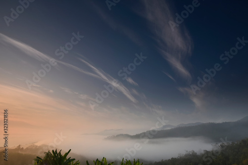 Twilight blue sky over a foggy valley in a morning © เท้ PY15MU