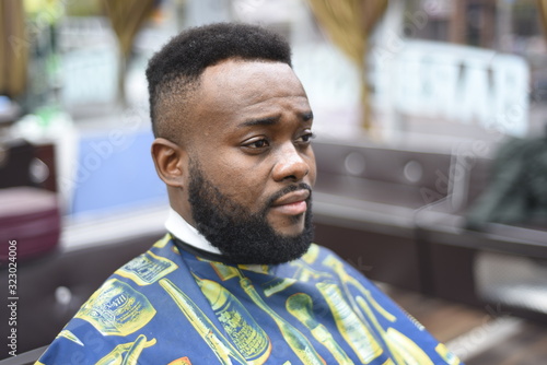Black Man In The Spanish Barbershop Cute Black Man Makes A Haircut In black-man-in-the-spanish-barbershop-cute-black-man-makes-a-haircut-in