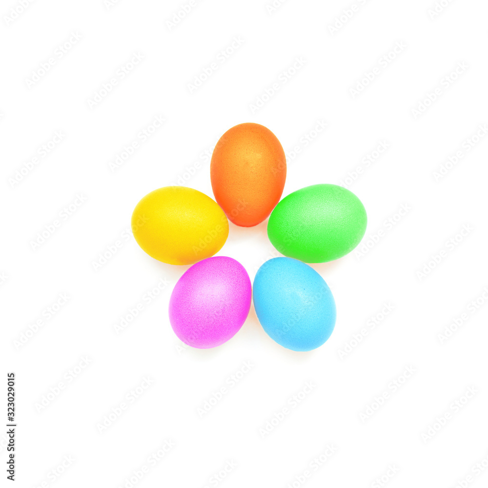 Five painted multi-colored chicken eggs are in the shape of a flower on a white background.