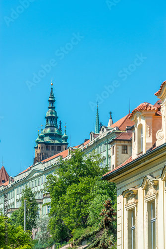 View of the top of old buildings with red roof and blue sky at Prague city Czech republic.