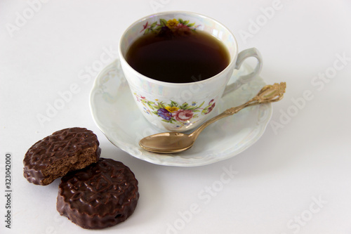 Cup of coffee with cookies and sugar