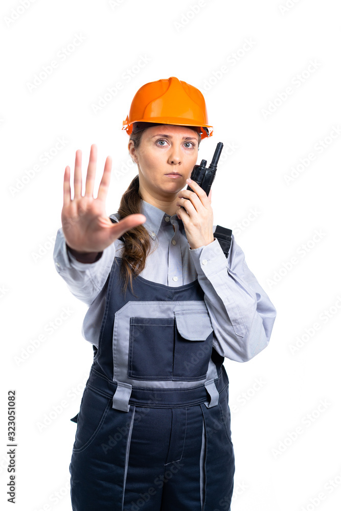 Girl builder talking on the walkie-talkie. isolated Girl builder talking on the walkie-talkie. isolated