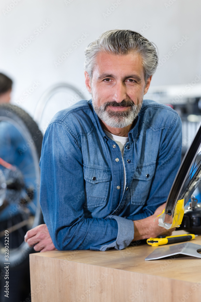 happy smiling working in a bike store happy smiling working in a bike store