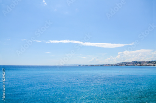 Coastline along Mediterranean sea in Nice, favorite vacation city in France, under morning sunlight