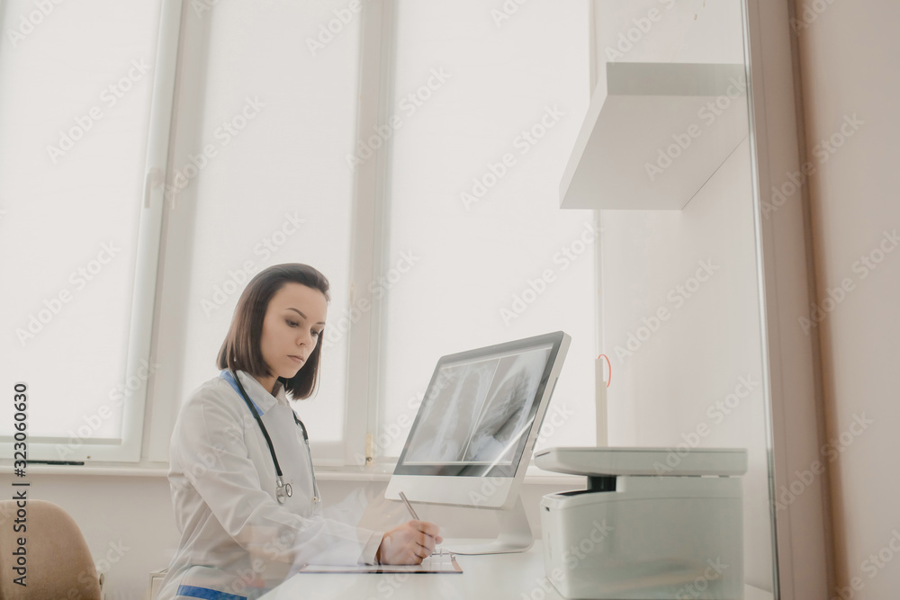 Young woman radiologist doctor analysis x-ray Young woman radiologist doctor analysis x-ray