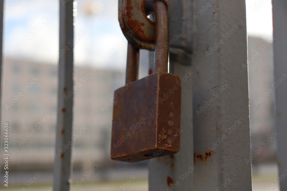 Old rusty iron gate lock. Protection against thieves. Old rusty iron gate lock. Protection against thieves.