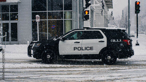 police car zooming by in the snow