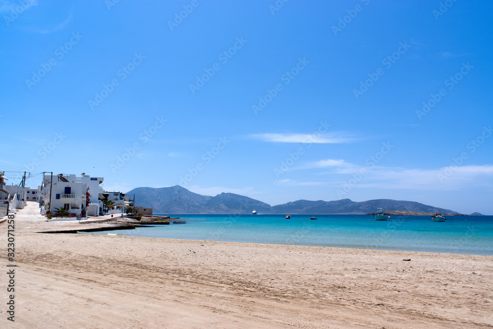 A view of the beautiful white sand beach at the harbour on the Greek island of Koufonissi.  A small and tranquil place with pristine beaches. An ideal spot to unwind.
