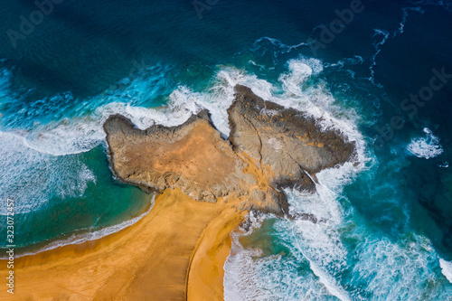 Aerial View Panorama Of El Islote de las Siete Viudas on the Cofete Beach Valley In Fuerteventura island, Spain. October 2019 photo
