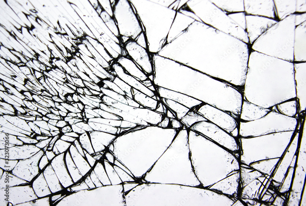 Cracks and lines on broken glass from impact.