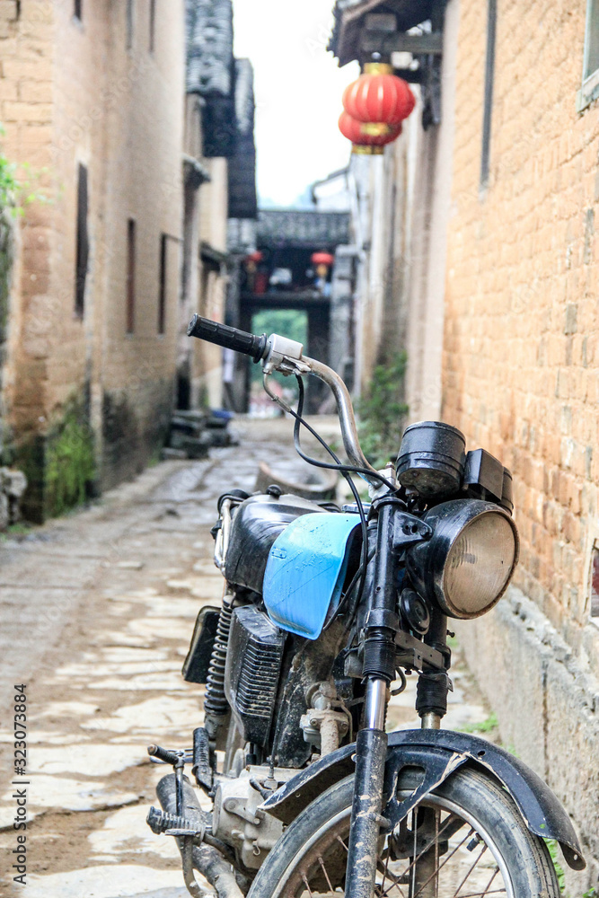 vintage motor bike in unknown oldtown of Huangyao in Zhaoping County, Guangxi, China