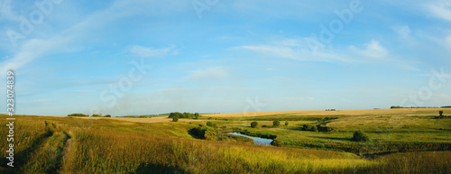 landscape with wheat fields and blue sky