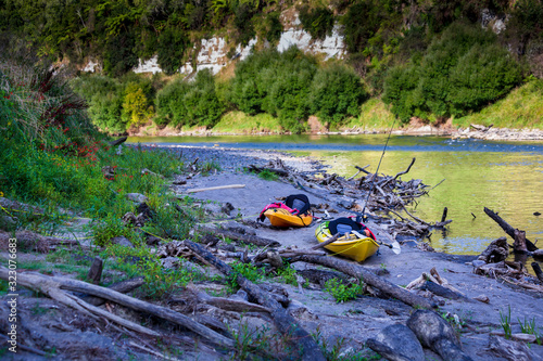 Kayaks on the Whanganui river bank photo
