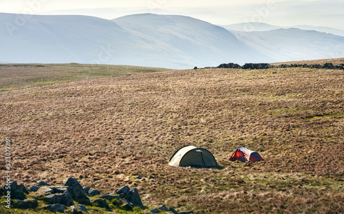 Two tents pitched near the summit of Thornthwaite in the Lake District UK. photo