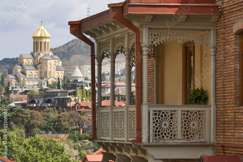 Georgia: Tbilisi - typical balconies and Sameba cathedral photo