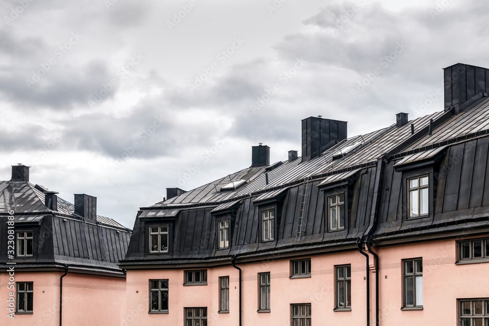 Pastel colored buildings with black roofs