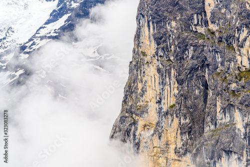 The Swiss Alps at Murren  Switzerland. Jungfrau Region. Tops of the mountains in fog and clouds.
