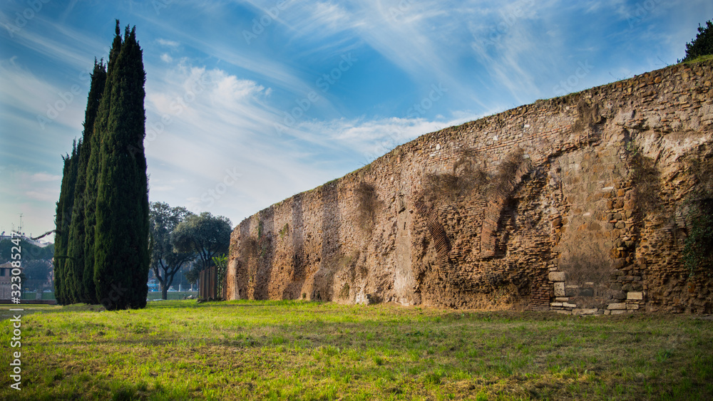Ancient roman ruins under an amazing sky near Circo Massimo, Rome, Italy.