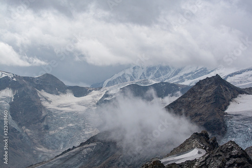 A view of the remnants of the glacier on a cloudy day in the Austrian Alps