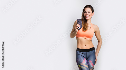 Beautiful fitness girl model isolated on white background. Sport and healthy lifestyle