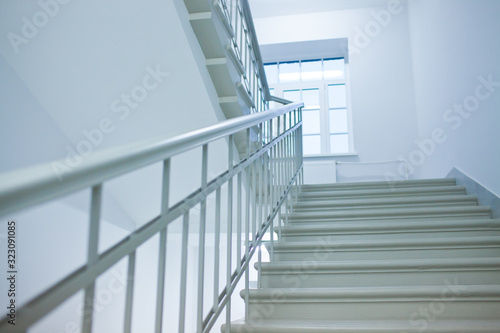 A white stairs up ladder in a new office building © tsuguliev
