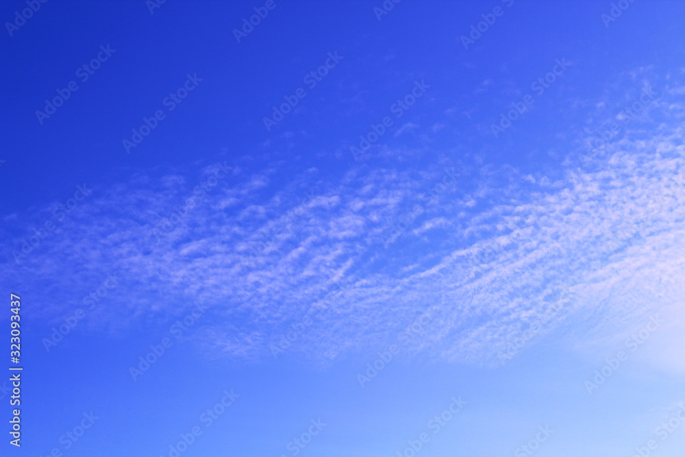Fototapeta premium Beautiful blue sky and white thin cirrus clouds. Background. Scenery. Panorama.